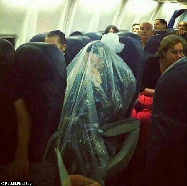 Jewish man photographed covering himself in plastic bag during flight to separate himself from the filthy non jews.jpg