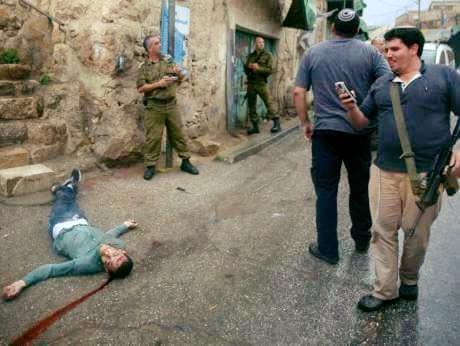 Jews enjoying snap shots after killing more children.jpg